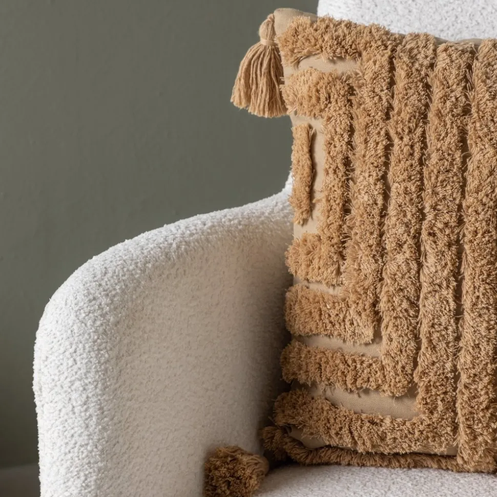 Como fåtölj i vit boucle