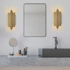 Vägglampa i guldutförande - Munspel